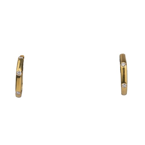 100 - Mappin & WebbA pair of 18k gold channel-set diamond hoop earrings.Total weight: Approx. 10 g.... 
