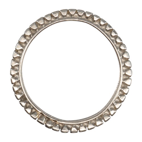 102 - A good quality baguette diamond and platinum full eternity ring, circa 1970The band channel-set with... 