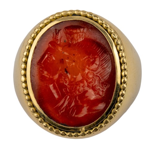 104 - Romano-Egyptian, 1st centuryA Zeus Ammon and Isis carnelian intaglio dress ring. Set in a later heav... 