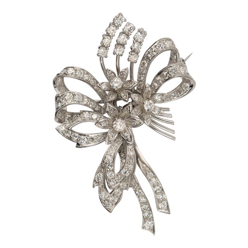 103 - A platinum and diamond spray brooch, circa 1950The spray of flowers tied with a diamond-set bowDimen... 