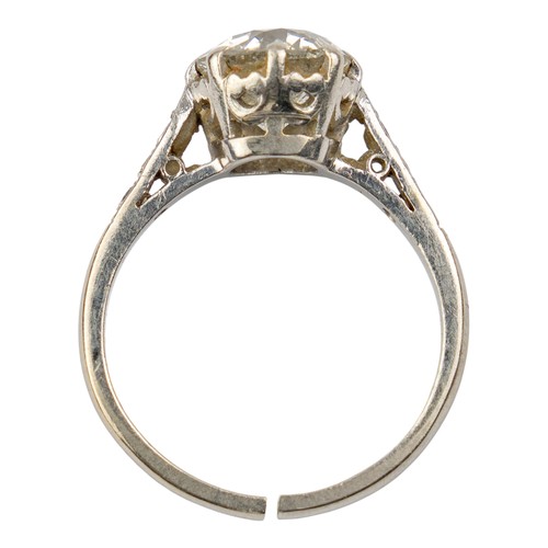 117 - An old-cut diamond, claw-set in a coronet platinum mountWith small diamond shoulders. The central st... 