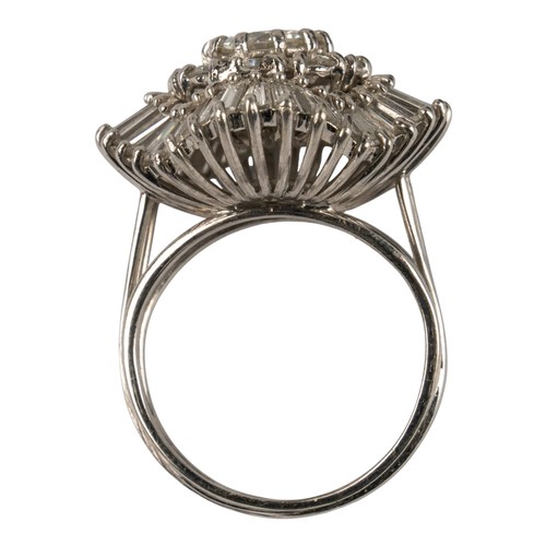 114 - A fine diamond-set dress ring, circa 1950sSet to the centre with a single brilliant-cut diamond, wit... 