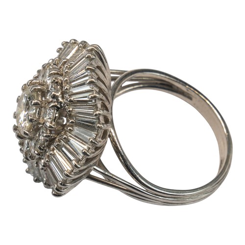 114 - A fine diamond-set dress ring, circa 1950sSet to the centre with a single brilliant-cut diamond, wit... 