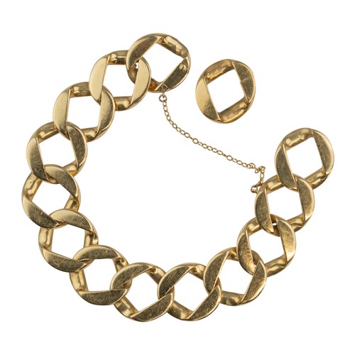 115 - Cartier, London, A large and heavy flattened curb-link gold braceletComposed of large open flat curb... 