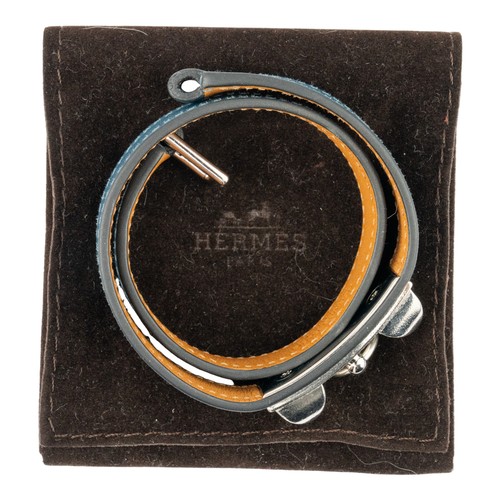 143 - Herm&egrave;s, A blue leather H braceletTogether with a pair of Herm&egrave;s black leather glovesTh... 