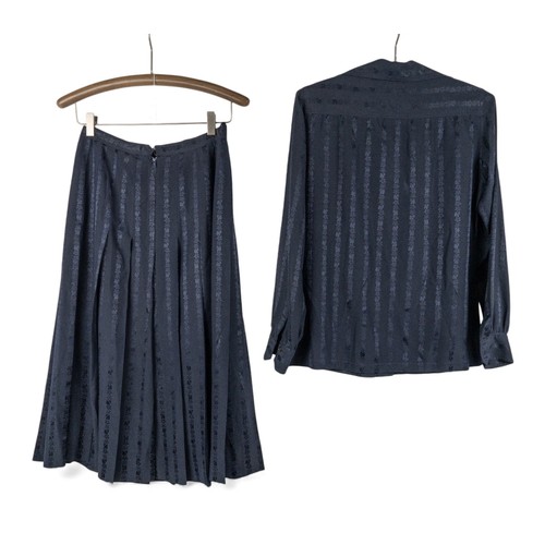145 - A vintage 1970s Celine ensembleConsisting of navy blue silk skirt and matching shirtFrench size 42To... 