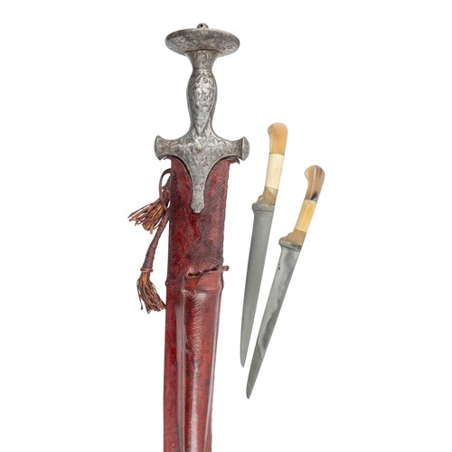 Indian, 19th centuryA Talwar with two smaller daggers in a red leather ...