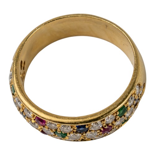 77 - A diamond, ruby, emerald and sapphire pave-set band ring, circa 1980The top designed as five small f... 