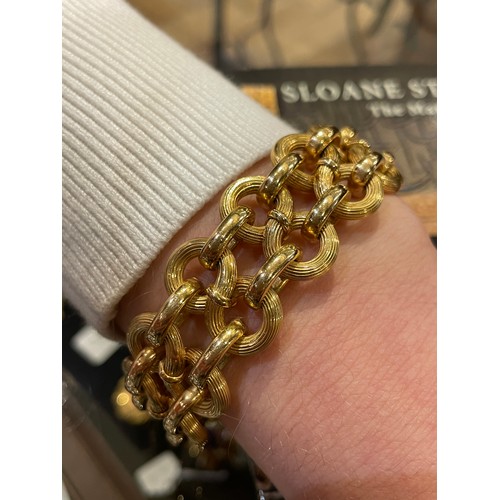 97 - An 18k gold figure-of-eight-link bracelet, circa 1950sTotal length: Approx. 21.5 cm.Total weight: Ap... 