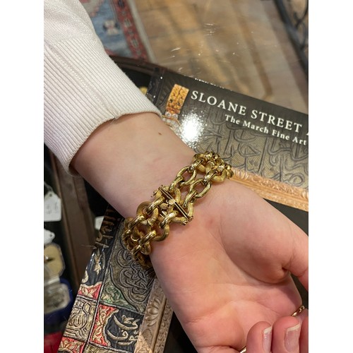 97 - An 18k gold figure-of-eight-link bracelet, circa 1950sTotal length: Approx. 21.5 cm.Total weight: Ap... 