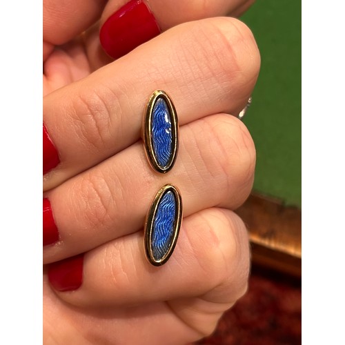 66 - A pair of rose-coloured gold enamel and diamond cufflinks, probably Russian.The circular tops with p... 