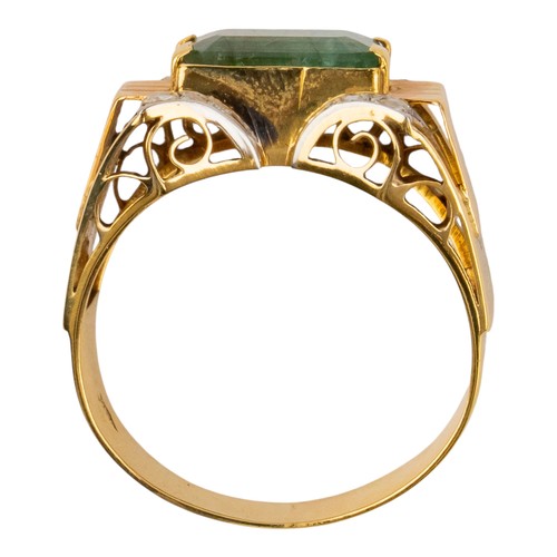 7 - ContinentalArt DecoAn 18 carat gold, emerald and diamond cocktail ringOf odeonesque design, set to t... 