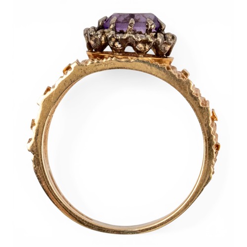 6 - Circa 1970s, A 9ct gold, diamond and amethyst ring.The bark-textured shank applied with a small amet... 