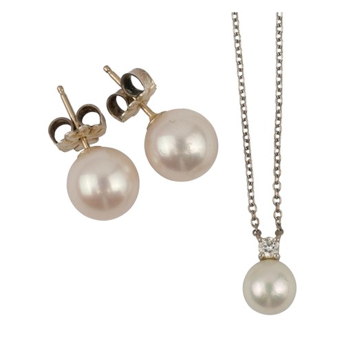 14 - Tiffany & Co, A white cultured pearl and diamond pendant Set in white gold, The pearl 6.3 mm.Tog... 