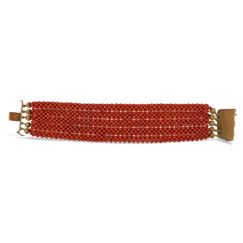 22 - A coral and gold bracelet, Italian, circa 1940sComposed of five mesh-link rows of coral beads. With ... 