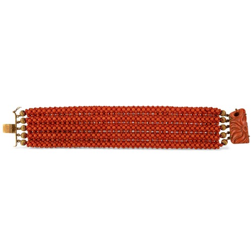 22 - A coral and gold bracelet, Italian, circa 1940sComposed of five mesh-link rows of coral beads. With ... 