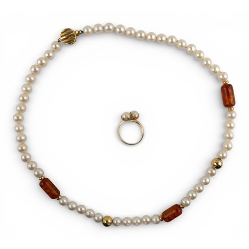 24 - AmericanA 14k gold cultured pearl and amber necklace (46 cm.) and a two-stone yellow gold crossover ... 