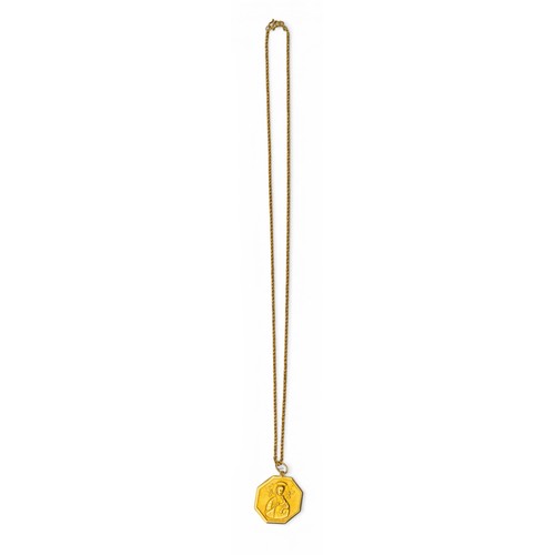 29 - A yellow gold Madonna and child pendant on chainThe octagonal pendant depicting a Madonna and child ... 