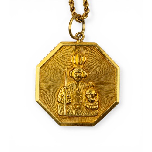 29 - A yellow gold Madonna and child pendant on chainThe octagonal pendant depicting a Madonna and child ... 