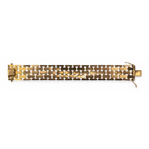 37 - Circa 1960s, An 18ct yellow gold bark-textured stylised brick-link braceletComposed of polished, fac... 
