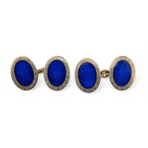 40 - British, circa 1960A pair of 9ct gold and enamel cufflinks. The oval shaped heads with a royal blue ... 