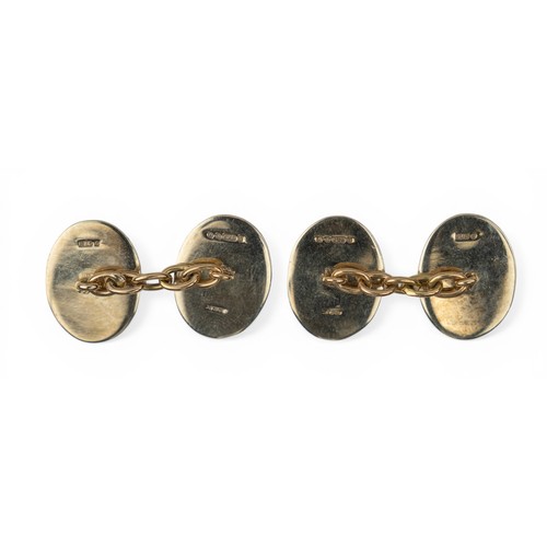 40 - British, circa 1960A pair of 9ct gold and enamel cufflinks. The oval shaped heads with a royal blue ... 