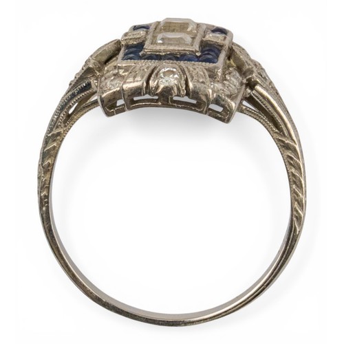 46 - Art Deco, A pretty diamond and calibre sapphire dress ringSet to the centre with two square-shaped d... 