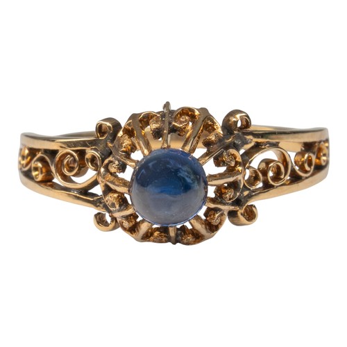 53 - An antique cabochon sapphire and rose gold ring, circa 1880The antique ring set to the centre with a... 