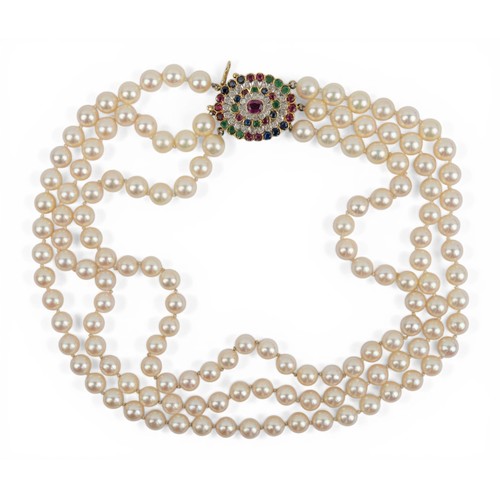 59 - A three-row cultured pearl, diamond and gem-set choker necklaceThe slightly graduated pearls of good... 