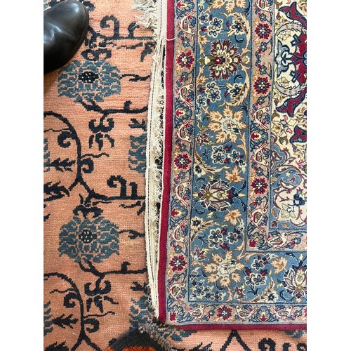 An Isfahan rug A deep raspberry field with palmettes and strolling ...
