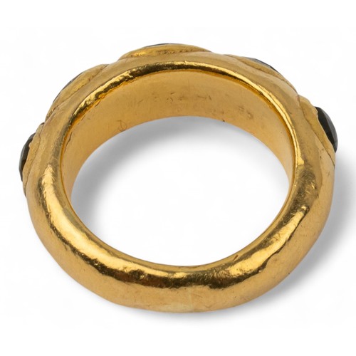 6 - Indian, A high-carat gold band ringSet to the front with five oval-shaped rose-cut greenish foiled s... 