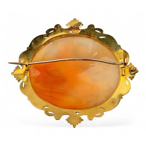 10 - Victorian, A shell cameo gold-mounted brooch, circa 1840The oval-shaped shell cameo depicting a wing... 