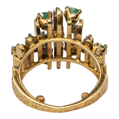 16 - Alan Gard style, 1970sAn abstract emerald and diamond dress ring, mounted in 18k yellow gold. Set th... 