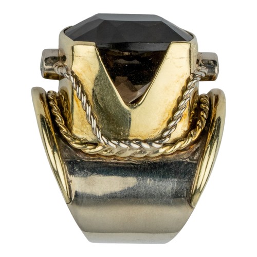17 - A striking smoky quartz, peridot and gold dress ringThe central cushion-shaped mixed-cut brownish qu... 