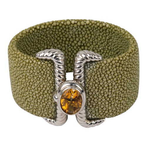 20 - A striking citrine and stingray cuffSet to the centre with a mixed-cut citrine in a buckle design, w... 