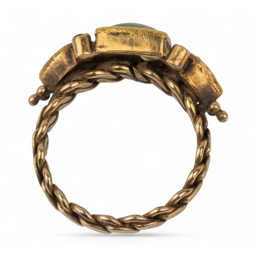 27 - Indian, A gold and gem-set ringThe top set with a cushion-shaped emerald, pear-shaped rose-cut diamo... 