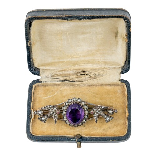 39 - Antique, An amethyst, split pearl and ruby broochThe oval-shaped mixed-cut amethyst of pretty colour... 