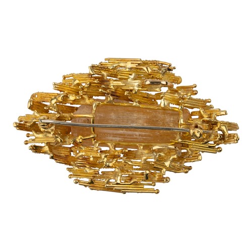 46 - Alan Martin Gard, dated 1967A bark textured abstract 18k gold topaz and diamond brooch/pendant. The ... 