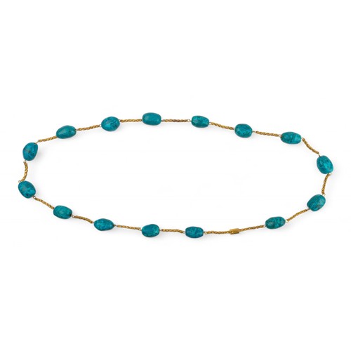 51 - An unusual turquoise matrix bead and yellow metal longchainThe chain composed of fifteen barrel-shap... 