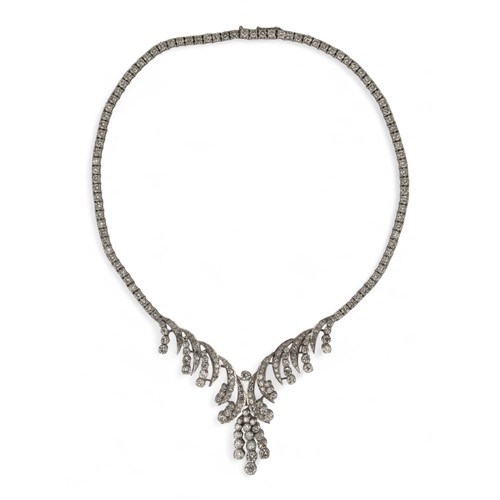 60 - Circa 1960s, A diamond necklaceThe scrolled front set with circular and brilliant-cut diamonds. With... 