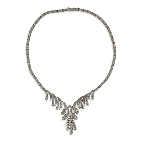 60 - Circa 1960s, A diamond necklaceThe scrolled front set with circular and brilliant-cut diamonds. With... 