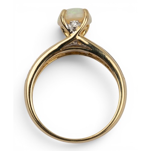 6 - An opal and diamond dress ringThe oval-shaped single-stone opal set with small diamonds to the shoul... 