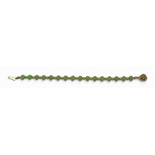 10 - A nephrite and 9ct gold braceletThe 6.8 mm. beads of pale green colour, strung with gold ball spacer... 