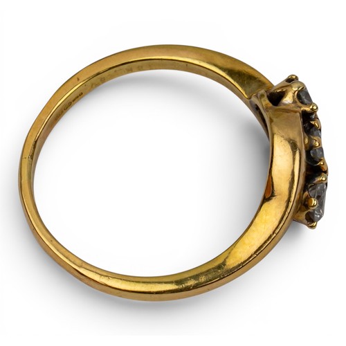 16 - An 18ct yellow gold and diamond three-stone ring, circa 1950sFinger size: PTotal weight: Approx. 4.4... 