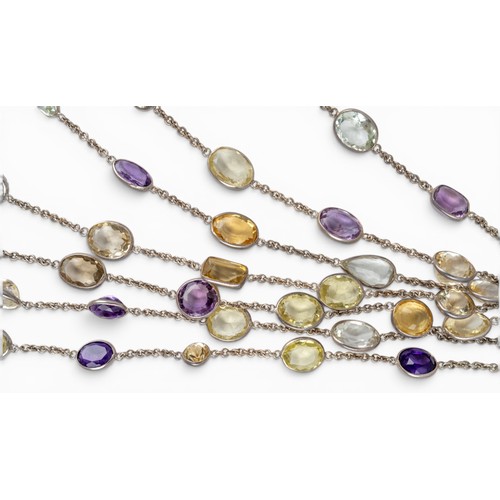 24 - A striking seven-row multi gem spectacle-set festooned chain necklaceSet throughout with citrines, a... 