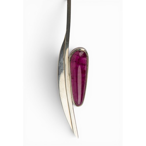 23 - Continental, A silver and red tourmaline necklaceThe stylised silver torque set with a large cabocho... 