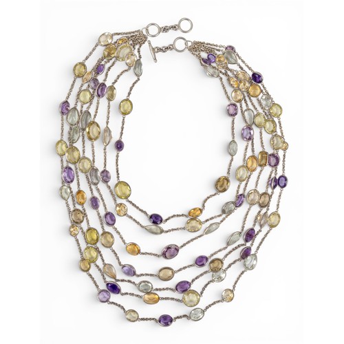 24 - A striking seven-row multi gem spectacle-set festooned chain necklaceSet throughout with citrines, a... 