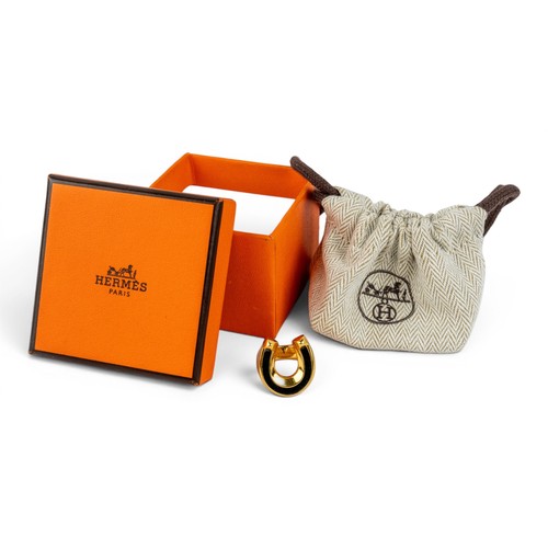 35 - Herm&egrave;s, A Jockette ringThe gold-plated and leather ring signed to the insideIn its original b... 