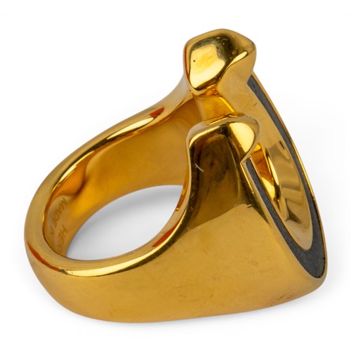 35 - Herm&egrave;s, A Jockette ringThe gold-plated and leather ring signed to the insideIn its original b... 