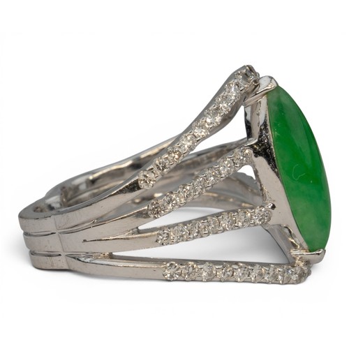44 - A fine jadeite and diamond cluster dress ringThe central marquise-shaped highly translucent emerald ... 